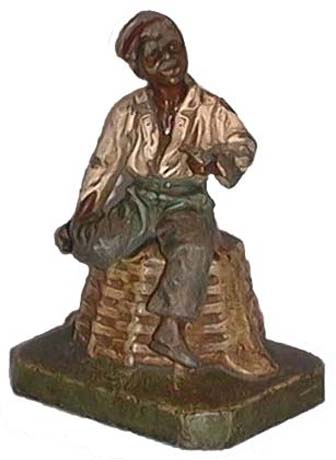 Boy Sitting on a Basket doorstop